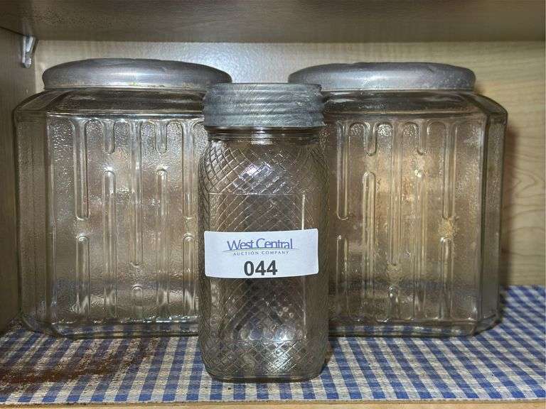 Three Glass Storage Jars with Metal Lids image