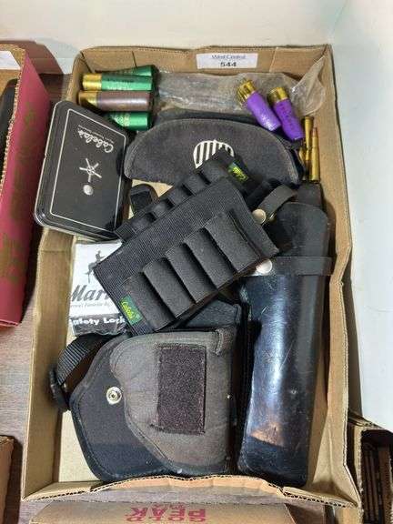 Variety of Firearm Accessories including Holsters and Ammunition image