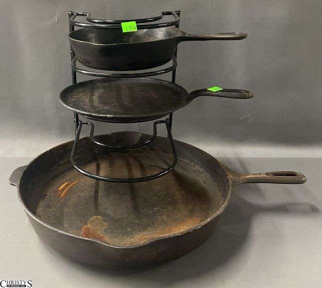 3 various size Cast iron skillets, with holder, largest 14" image