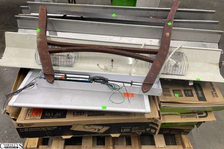 Skid of commercial lighting fixtures and bow saw, store return overstock shelf pull image