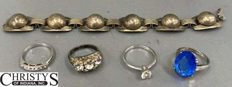 4 Rings and Bracelet Marked Sterling