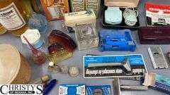 Razors, Blades, Remington Princess Electric Shaver in Original Box, Listerine, Killinger Hi-Jacs Cloth Coasters in Original Box, Hand Mirrors, Hair Combs, Perfume Bottles, Compact Purse Carry-All in Original Box, Bath Oil, Jergens Soap Bar
