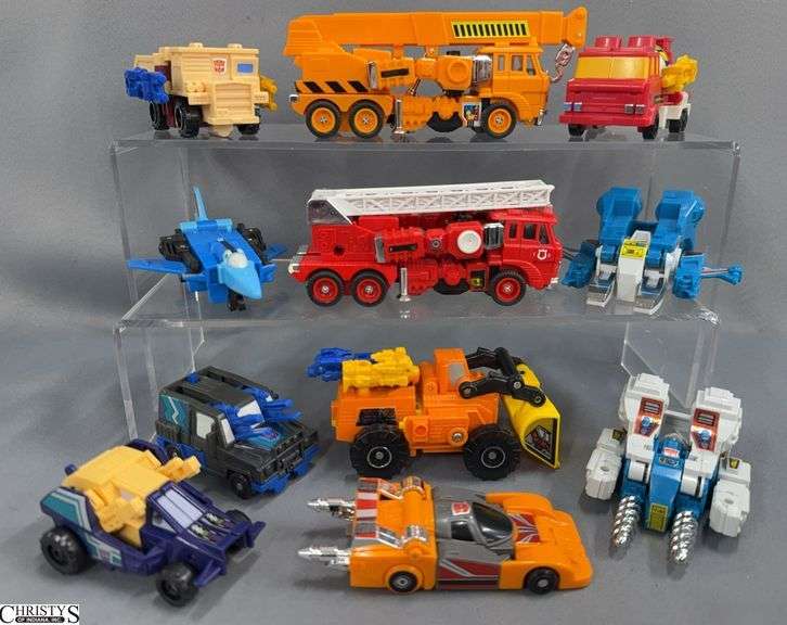 Vintage Transformers, Grapple, Inferno, Target Masters Scoop and Landfill, Quickmix, Dogfight, Topspin, Twin Twist, Triggerbots, Backstreet, Crankcase and Ruckus image