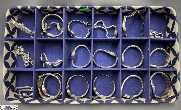 22 Wrist Watches in a Blue and White Display.  Includes Vanity Fair, Carriage, DMQ, Seiko and Others.