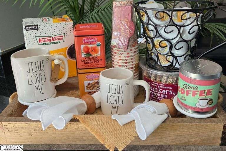 Wooden Tray, Keurig Pods, 2 Cans of Tea, 2 Jesus Loves Me Mugs, 2 Napkins w/ Rings, Coffee Candle, Dunkers Cookies, and Mug Rug image