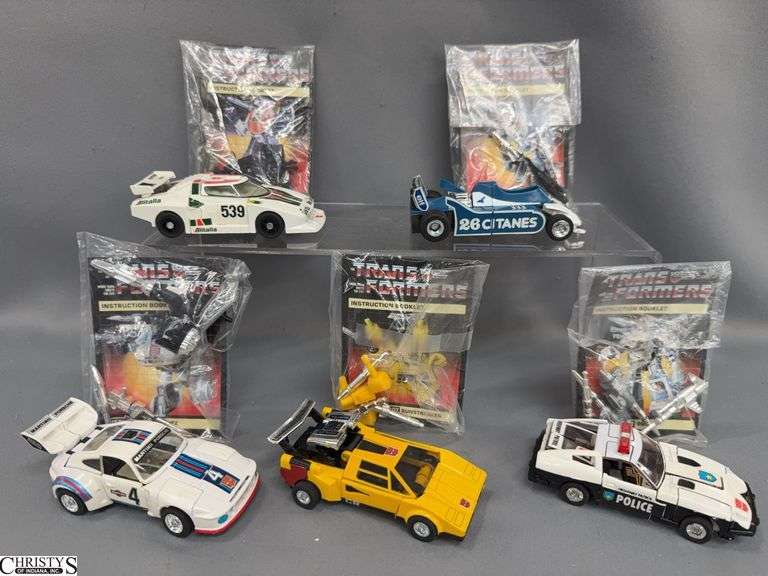 5 Heroic Transformers, Prowl, Sunstreaker, Jazz, Mirage, Wheel Jack With Books and Weapons image