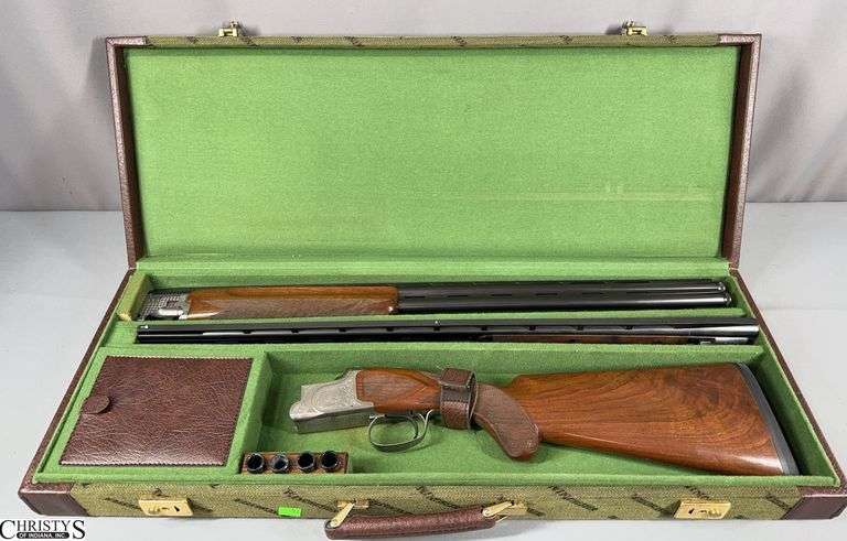 Winchester Classic Doubles Pigeon Grade Lightweight  Shotgun SN:  HS2-068E.  There are 2 Over/Under Barrels with this firearm- 28 ga. and 410 ga.  This firearm comes in a green Winchester Case.  The original gun boxes have been found.  See Photos image