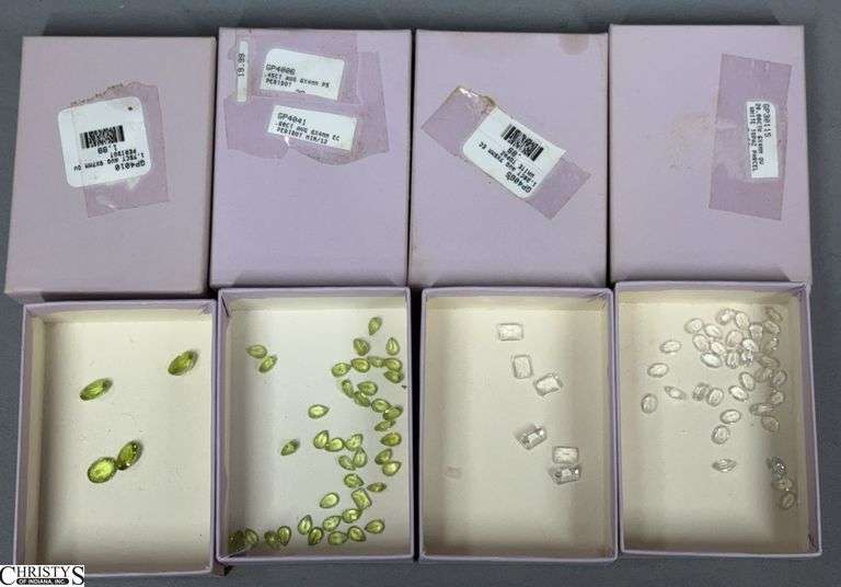 2 Small Boxes of Loose White Topaz Gemstones and 2 Small Boxes of Loose Peridot Gemstones image