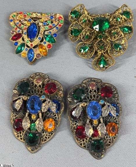 4 Beautiful Shoe Buckles in an Artstyle Chocolate Co. Metal Tin.  This includes a matching pair and 2 single shoe buckles.  There are a few tiny stones missing from the multi-color shoe buckles. image