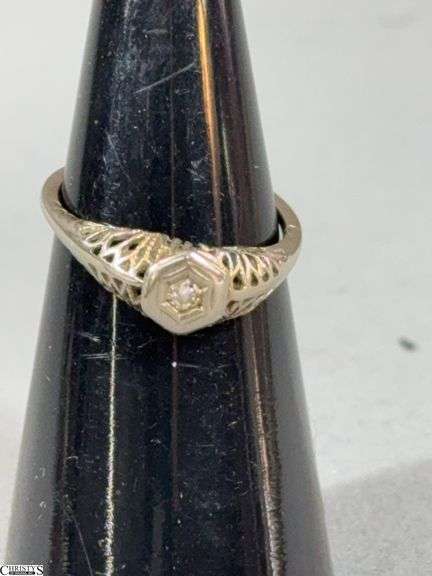 A Ring with a Center Diamond Stone.  The ring is unmarked but Tests 14K.  White Gold in Color. image