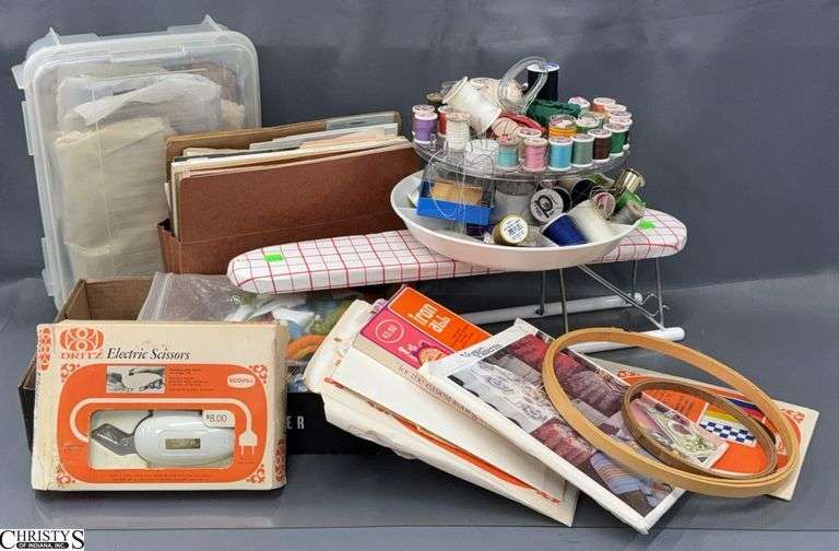Assorted Sewing Notions - Electric Scissors, Sewing Books, Thread, Tracing Paper, Sewing Kits, Sleeve Ironing Board - 22" of board image
