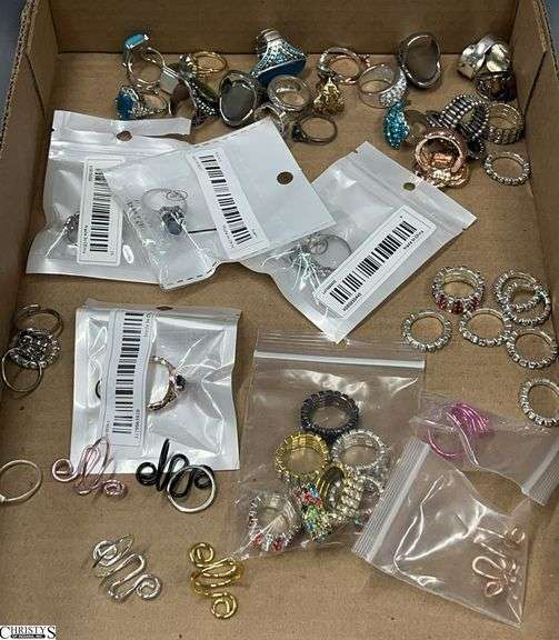 Approx. 50 Unmarked Fashion Rings.  4 are still in package