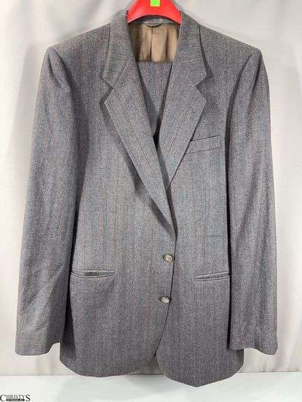 Gray Dimitri 2-Piece Suit.  The jacket and trousers are not marked with any size.  There is a small hole in the shoulder of the jacket.  See Photo.  The trousers look to be about size 36. image