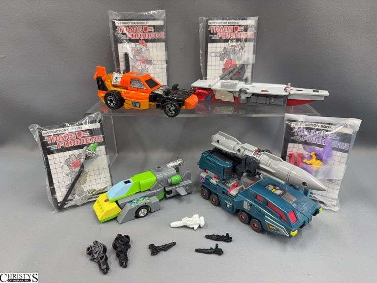 Transformers Double Dealer with Booklets, Triple Changer Broadside, Sandstorm, and Springer With Books and Weapons image