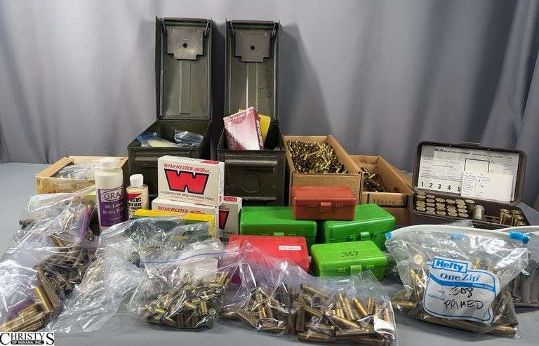 A Lot of Brass Pieces of Various Calibers, Opened Bottles of Graf Hi-Luster Brass Polish, and 2 Green Metal Ammo Cans with Brass image