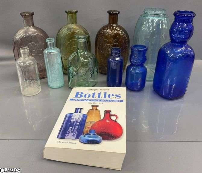 2008 Antique Trader Bottle Reference Book and Assorted Glass Bottles and Jar - 9" of tallest image
