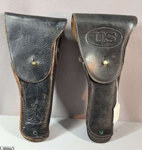 2 Military Type Holsters.  One has a tag marked Vietnam Era image