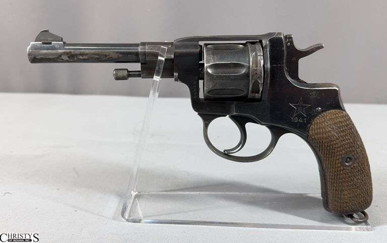 Russian Nagant M1895 Revolver cal. 7.62mm SN: H0450 with Holster .  Early 1941 with Arrow in Star, 7-Shot, Single Action.  Seller says it was brought back from WWII by a G.I. image