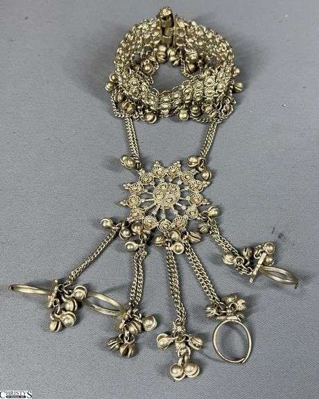 Unique Silver-Tone Slave Bracelet/ Hand Harness/ Ring Bracelet That Features a Center Medallion, Dangling Chains with Bells and 4 Attached Finger Rings (1 is missing) image