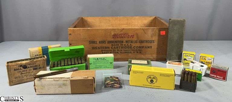 Wooden Western Box with Misc. Ammunition and Pellets, Craftsman Hole Punch Set.  Also includes a Clymer Rifle Finisher Marked 6.5MM WCH.  Ammo includes an Unopened Box of 20 Armor Piercing Caliber .30 M 2, Some Dummy Cartridges, Cal. .223 Remington, Green Plastic Box with 44 Mag. Ammo and Brass Pieces and More image