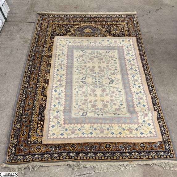 2 Area Rugs 65" x 93" of largest - shows wear image