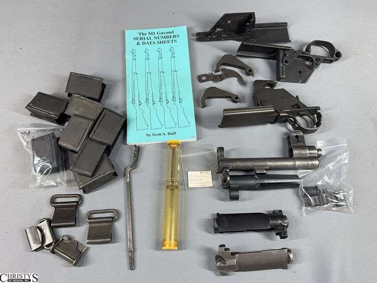 M1 Garand Parts Including Bolts, Rear Sights and Parts, Sling Parts, 8 5-Round Clips, and The M1 Garand Serial Numbers & Date Sheets Book image