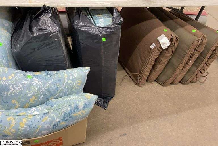 7+ Outdoor Cushions, 3 Brown, Remaining Are Blue Tone Floral Pattern image