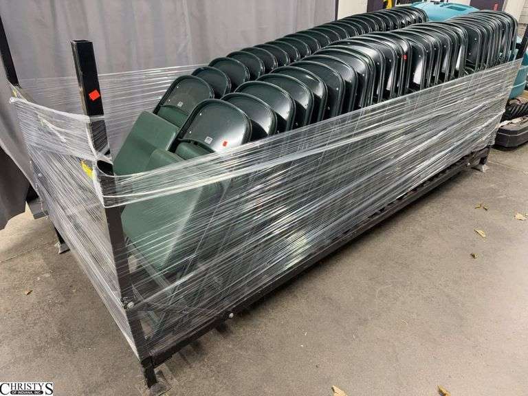 Rack With Green Vinyl Padded Folding Chairs Rack Does Not Have Wheels Approx 55 Chairs image