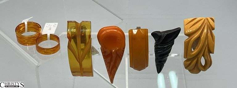 Bakelite Apple Juice Clip and 2 Rings Reversed Carved, 4 Other Clips image