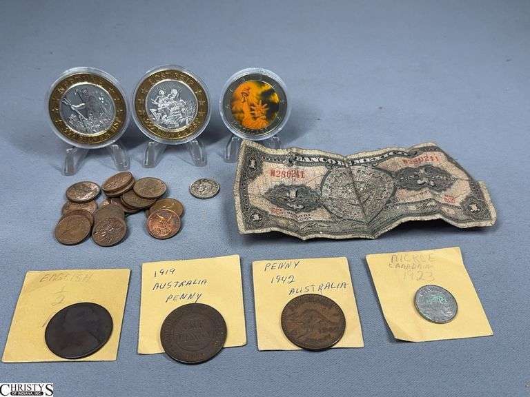 Miscellaneous Tokens and Foreign Coins- 2 Norwegian Cruise Line .999 Silver HSP (heavy silver plate) Tokens, 16 Canadian Pennies, 1945 Canadian Dime, 1923 Canadian Nickel, 1919 Australia Penny, 1942 Australia Penny, 1862 Great Britain Half  Penny, Banco of Mexico Un Peso Bill, and a 2001 Liberty $10 Holographic Coin with COA image