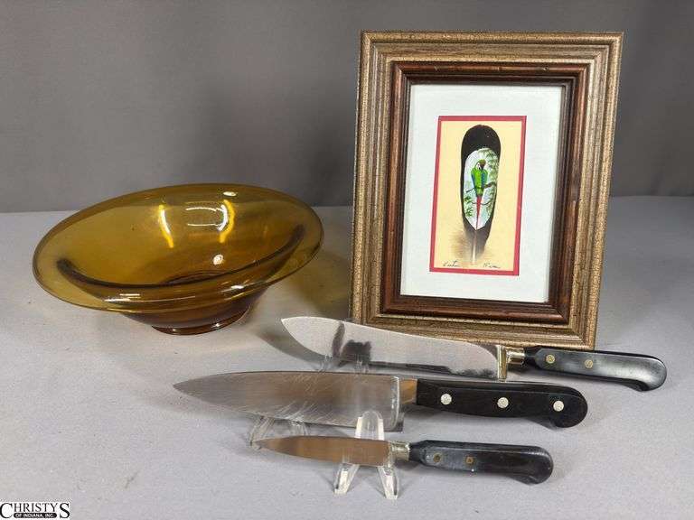 Amber Depression Glass Waterfall Bowl 9 1/2" Round Top, a Framed Feather Art Piece Featuring a Macaw Parrot 8"x10", and 3 Knives (1 marked Granny's Parer Imperial Stainless and 1 Marked Granny's Butcher Knife Imperial Stainless) image