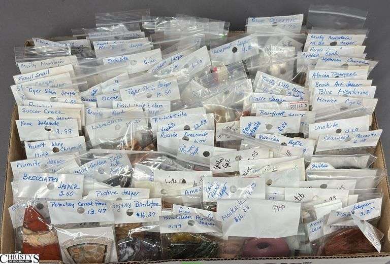 A Flat of Single Stone Pendants in Individual Packages.  Most Packages are labeled. image