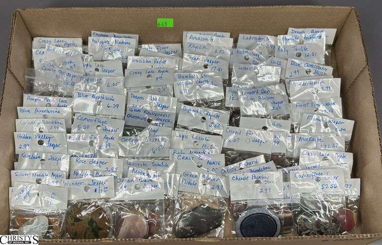 A Flat of Single Stone Pendants in Individual Packages.  Most Packages are labeled. image