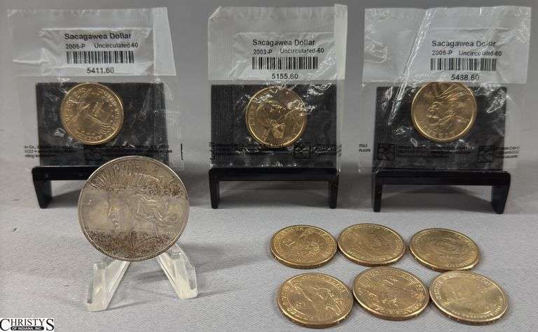 1922 Silver Peace Dollar, 3 Sacagawea Dollars Uncirculated-60 in Littleton Coin Co. Packages ( 2003-P, 2005-P & 2006-P) and 6 Presidential "Golden Dollar" Coins image