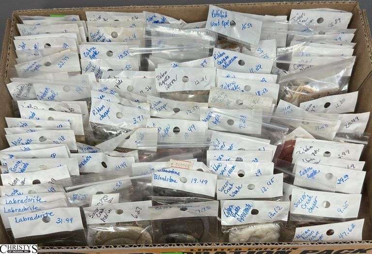 A Flat of Single Stone Pendants in Individual Packages.  Most Packages are labeled. image