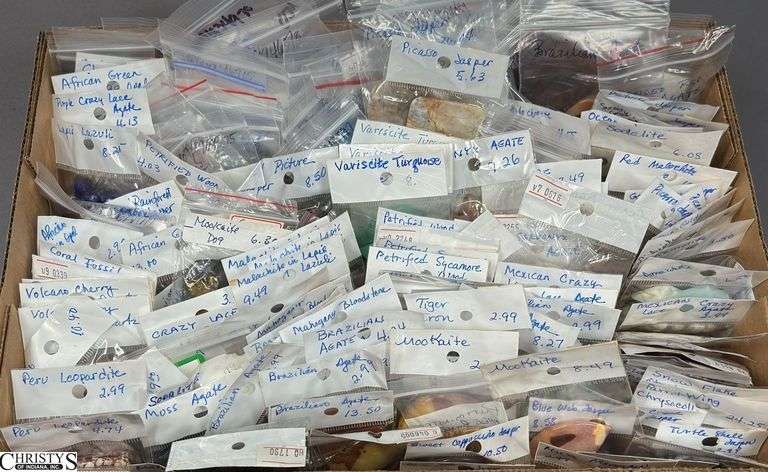 A Flat of Single Stone Pendants in Individual Packages.  Most Packages are labeled. image