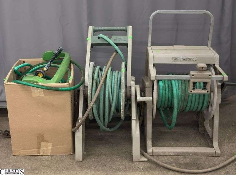 2 Hose Reels, 3 Sprinklers, and Assorted Garden Hoses - Shows considerable wear from outdoor use and storage image