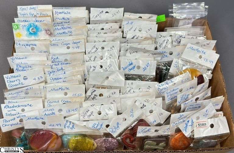 A Flat of Single Stone Pendants in Individual Packages.  Most Packages are labeled. image
