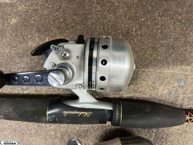 4 Fishing Poles, and Holder