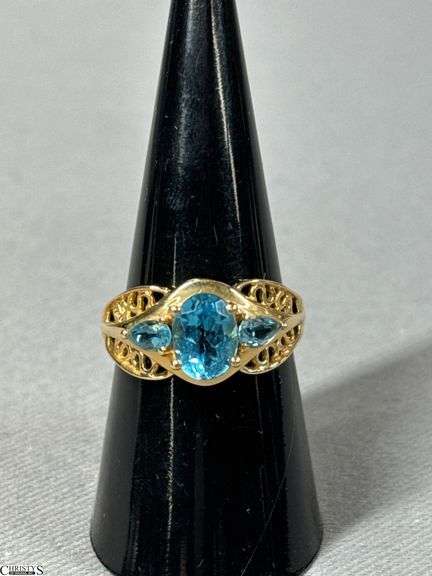 14K Yellow Gold Ring with 3 Aquamarine Colored Stones image