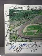 Indianapolis Motor Speedway 40" X 13.5" Areal Photo with Autographs.  Signatures Include Andy Hillenburg, Paul Goldsmith, Johnny Rutherford, DIZ, John Martin, and Many Others.