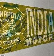 2 Indianapolis Motor Speedway Autographed Pennants.  Signatures include Mark Dismore, Scott Herrington, Lloyd Ruby, Jim Rathmann and Others.