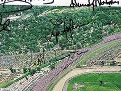 Indianapolis Motor Speedway 40" X 13.5" Areal Photo with Autographs.  Signatures Include Andy Hillenburg, Paul Goldsmith, Johnny Rutherford, DIZ, John Martin, and Many Others.