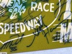 2 Indianapolis Motor Speedway Autographed Pennants.  Signatures include Mark Dismore, Scott Herrington, Lloyd Ruby, Jim Rathmann and Others.