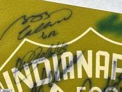 2 Indianapolis Motor Speedway Autographed Pennants.  Signatures include Mark Dismore, Scott Herrington, Lloyd Ruby, Jim Rathmann and Others.