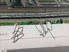 Indianapolis Motor Speedway 40" X 13.5" Areal Photo with Autographs.  Signatures Include Andy Hillenburg, Paul Goldsmith, Johnny Rutherford, DIZ, John Martin, and Many Others.