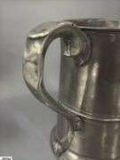 2 Pewter Tankards. Both Marked 'Quart' And Feature A Decorative Handle. One Mug Has GR 329 10 Stamped On It, And The Other Mug Has 1910 Stamped On It.