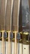 2 Sealed Packs of Laguiole, Dubost of France Ivory and Brass Cap Knives