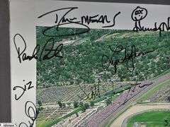 Indianapolis Motor Speedway 40" X 13.5" Areal Photo with Autographs.  Signatures Include Andy Hillenburg, Paul Goldsmith, Johnny Rutherford, DIZ, John Martin, and Many Others.