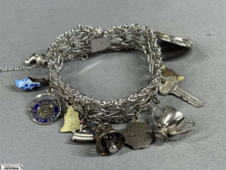 Charm Bracelet Marked Sterling .  Some of the charms are also marked sterling. image